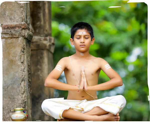 An Indian vedic student is meditating in the temple
