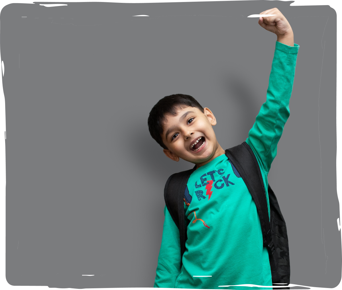A boy happily posing for the photo